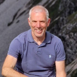 Photograph of Seamus Gallagher, founder of Ireland by Bike and Donegal Ebikes, on Mount Errigal, Co Donegal